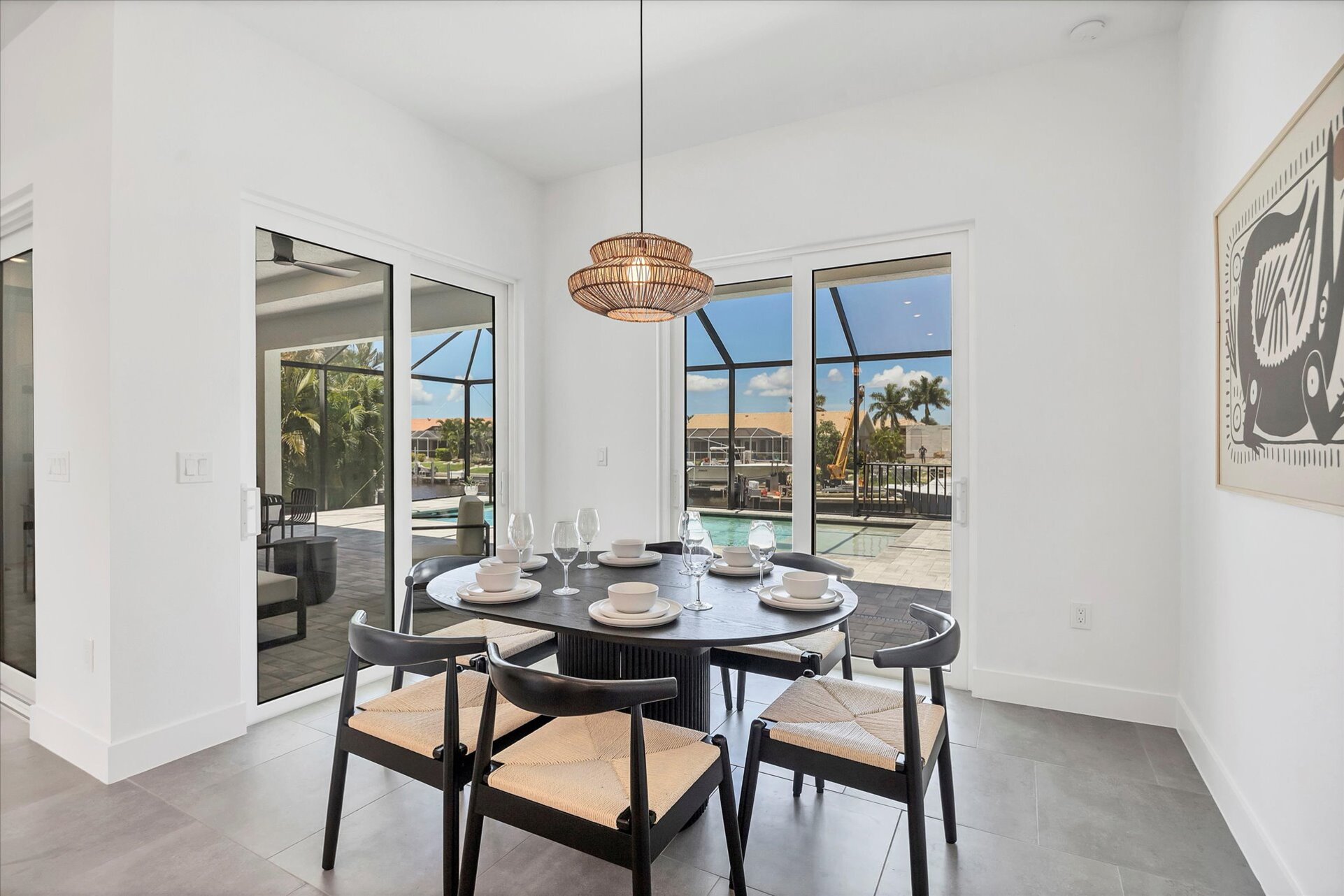 Dining area overlook pool and canal. Dining table seats 6
