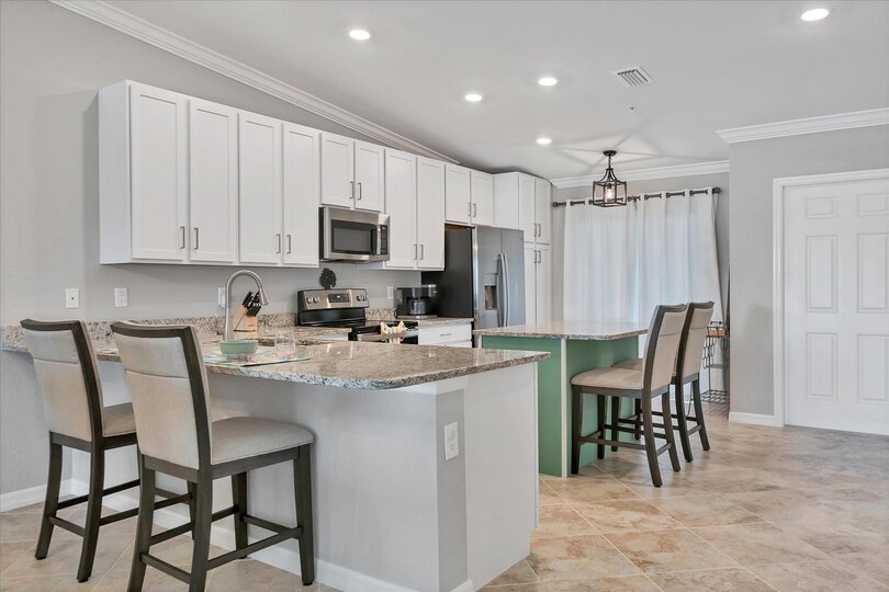 Bar stools provide 5 additional seats for dining
