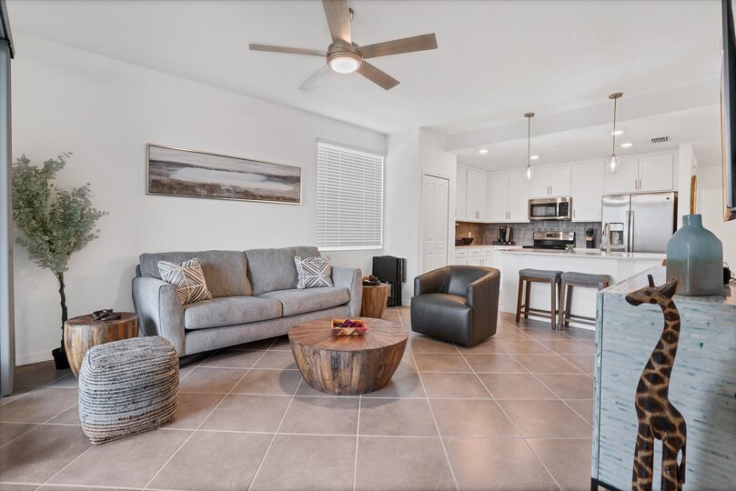 Bright, open living space. Living room features comfy seating and 55-inch Smart TV