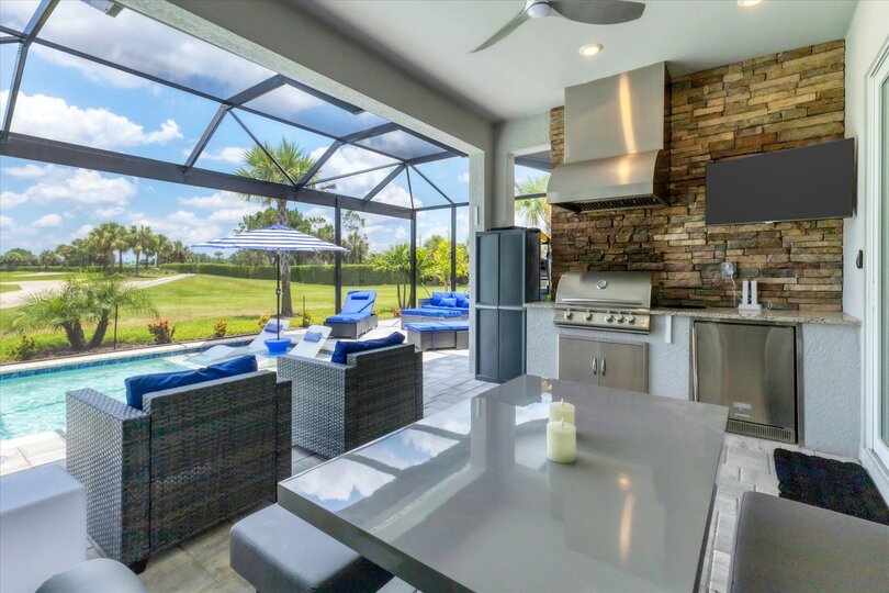Gorgeous outdoor living space with private pool loverlooking golf course