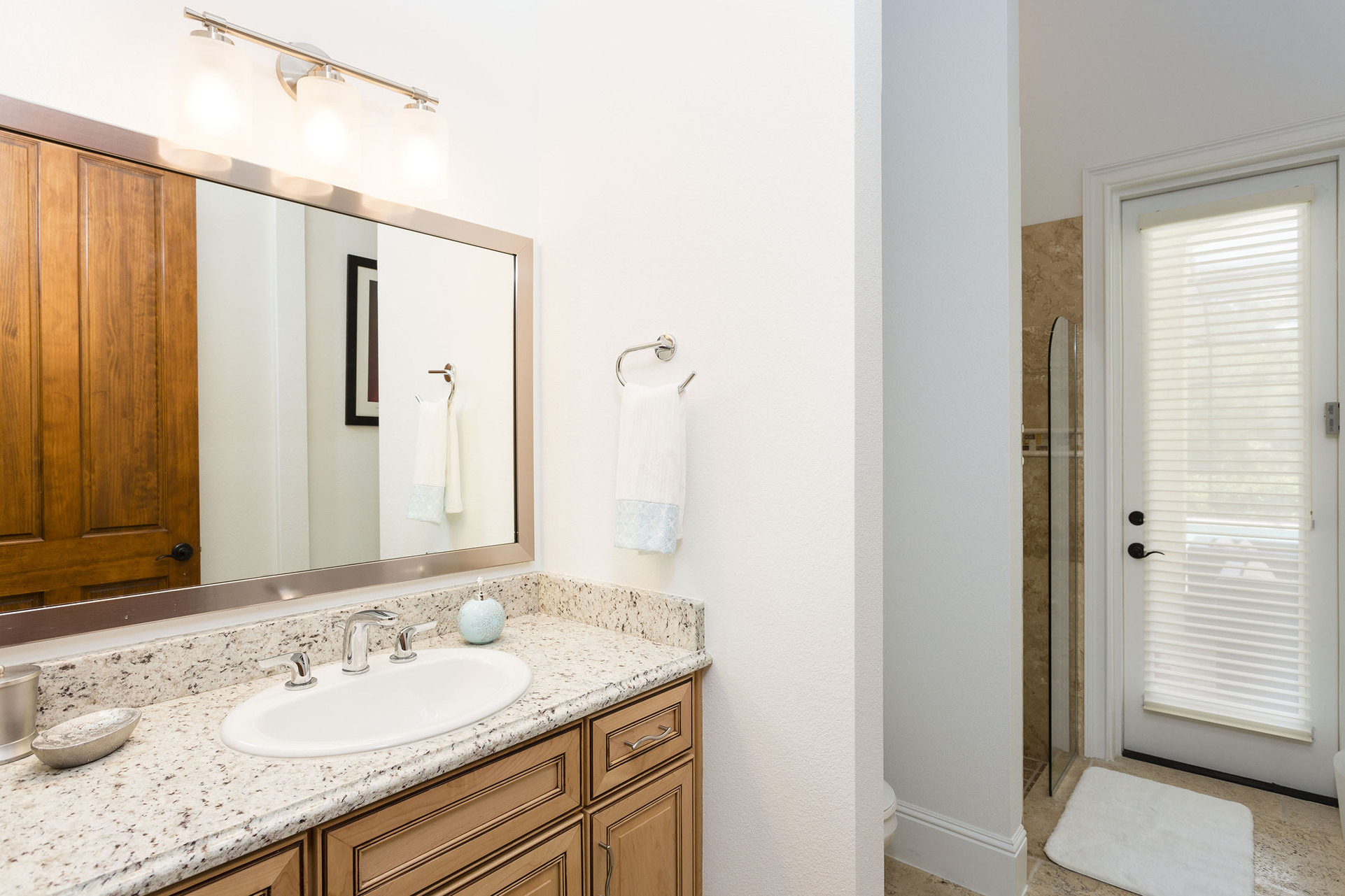 This first floor bathroom has convenient access to the pool