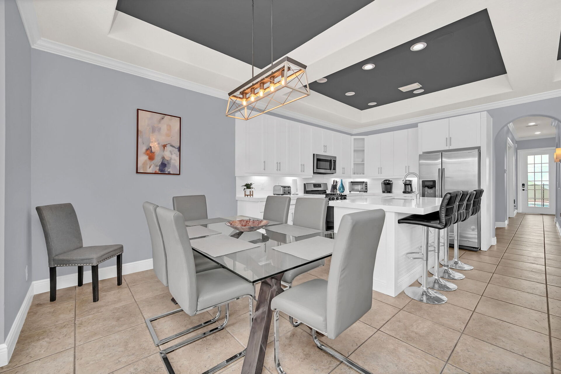 The dining table seats 7 with additional bar top seating of 4