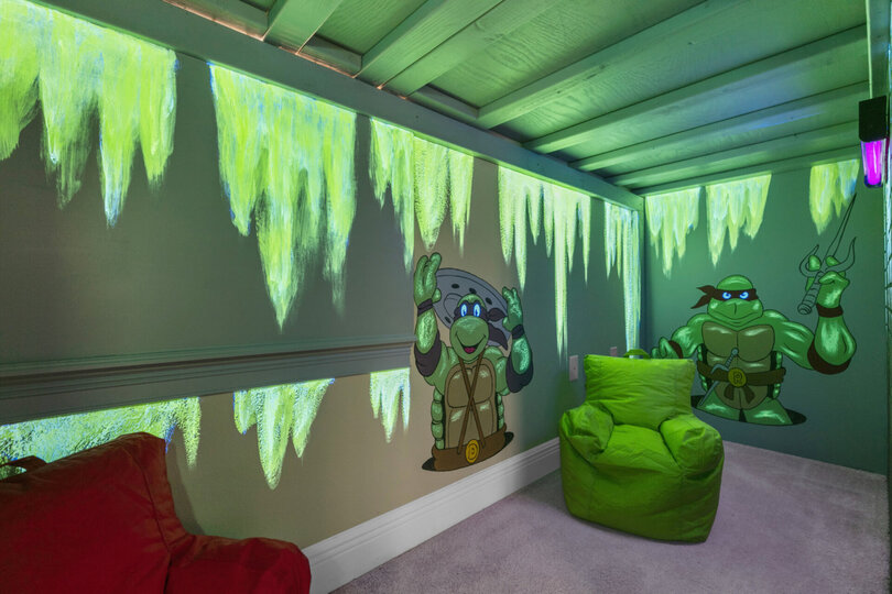 The kids can play in this underground play area featuring a Smart TV