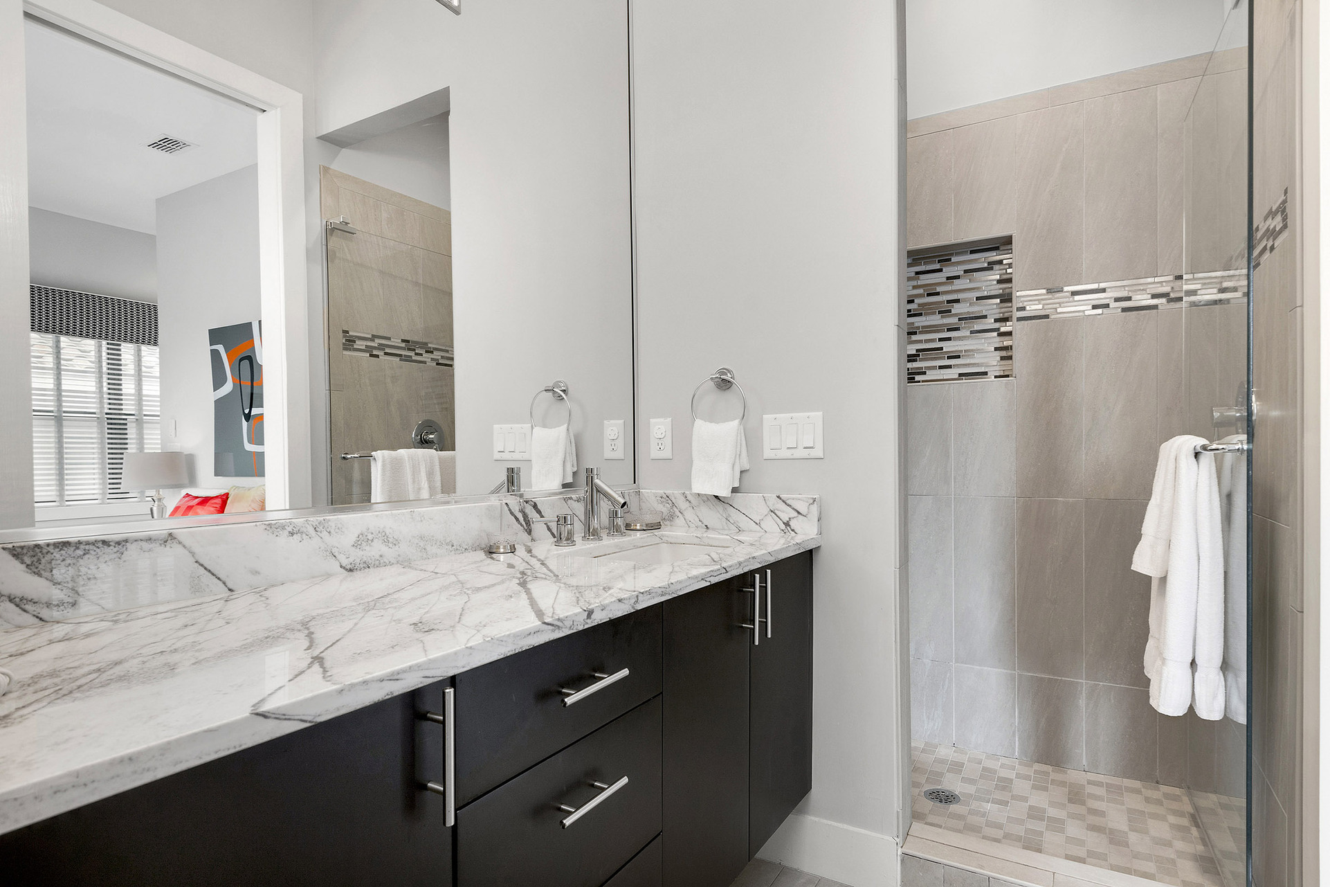 En-suite bathroom 2 has marble vanity and glass door walk-in shower