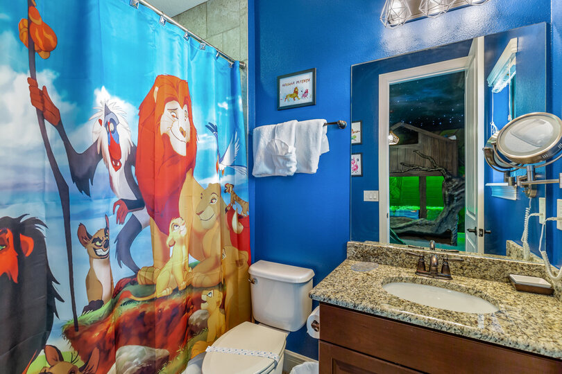 The en-suite bathroom features a shower/tub combination