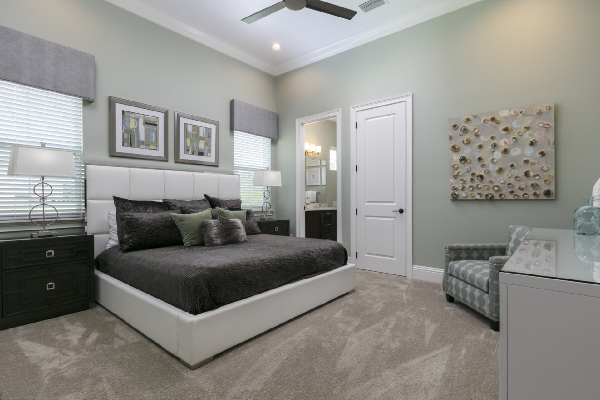This master suite located on the ground floor features a king size bed, en-suite bath, and 50-inch SMART TV