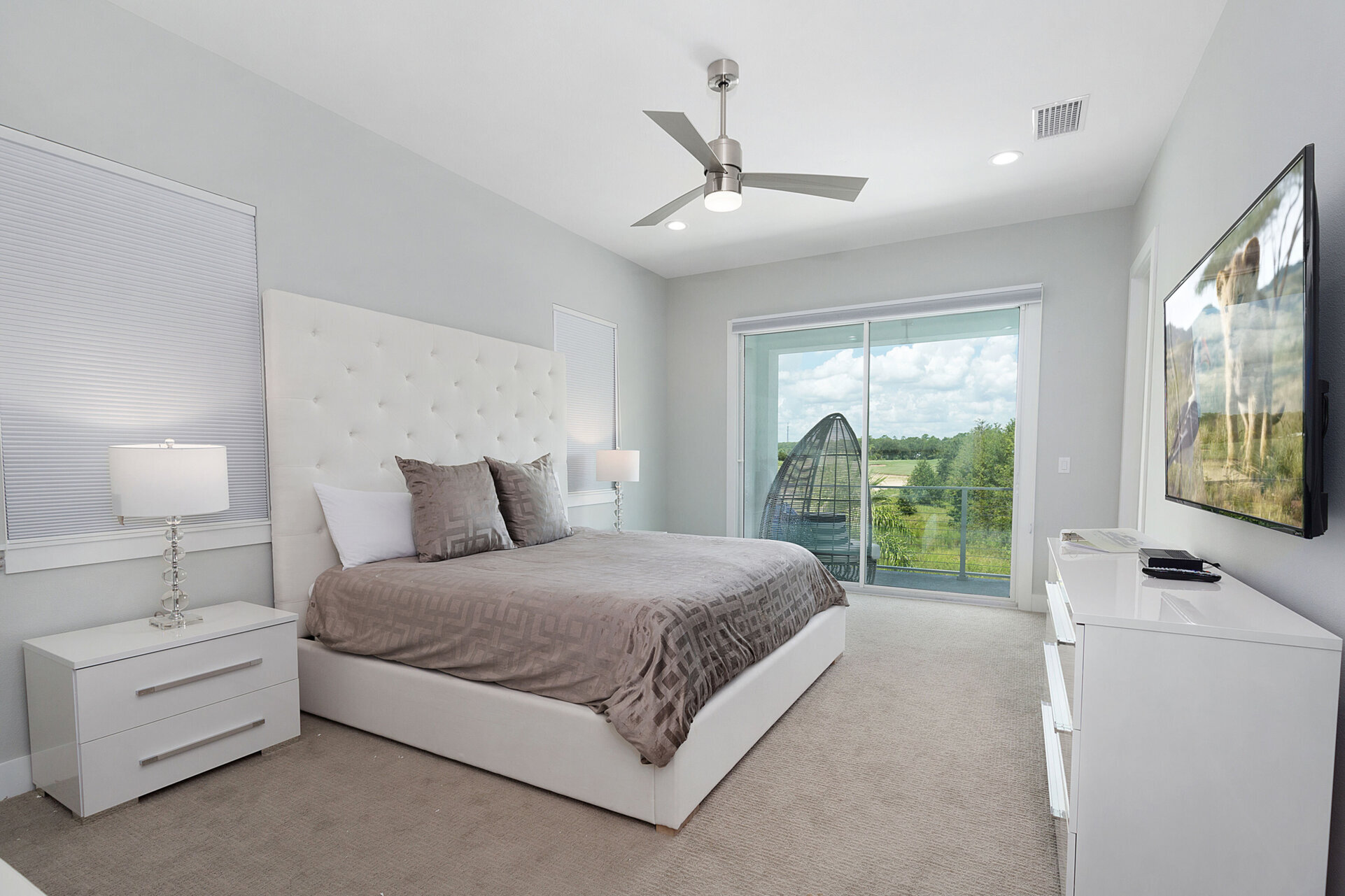 A beautiful master suite that has access to the second floor balcony