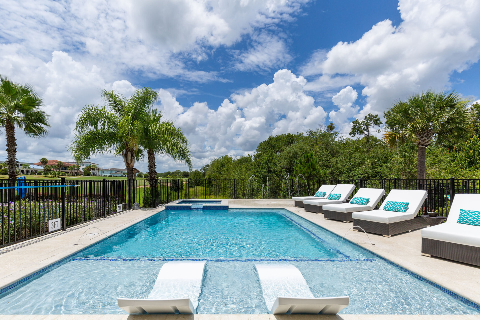 The custom built pool includes a sun ledge with 2 ledge loungers
