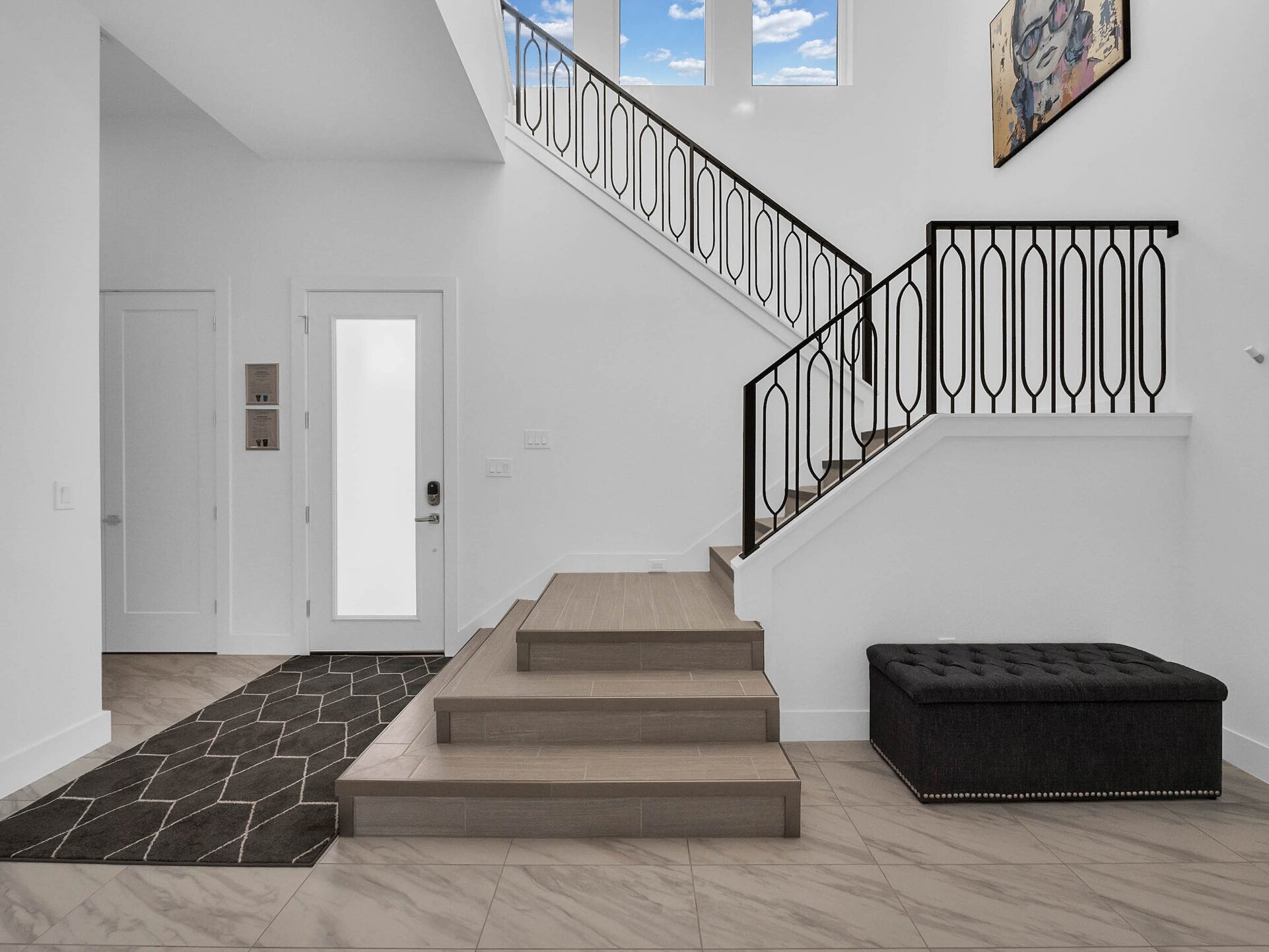 The stairs are located right by the entrance of the home