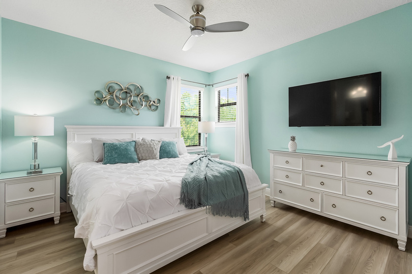 Second floor Master Suite furnished with king-size bed
