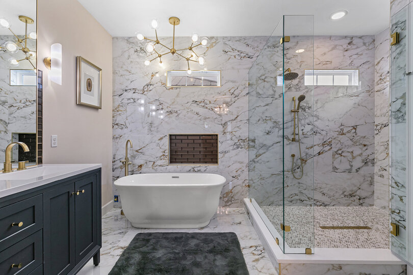 Large walk in shower with double shower heads.