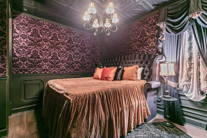 This Haunted Mansion themed room has a King sized bed, located on the second floor.