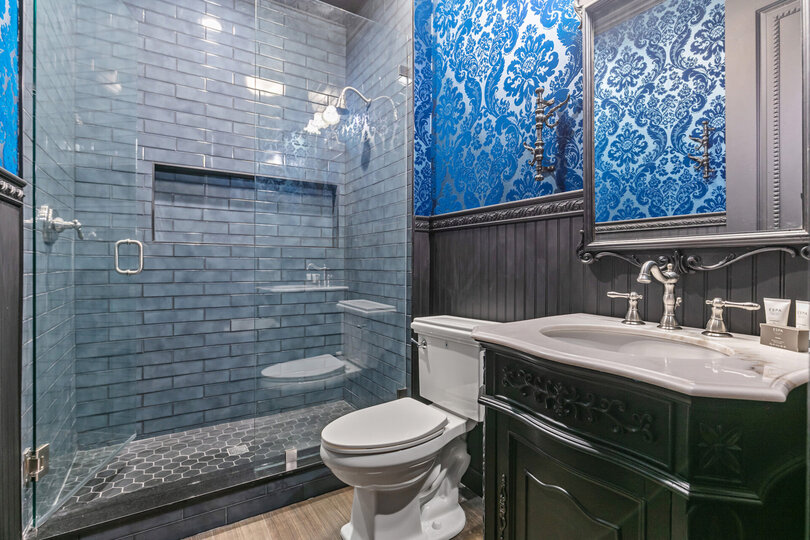 En-suite bathroom features a walk in shower.