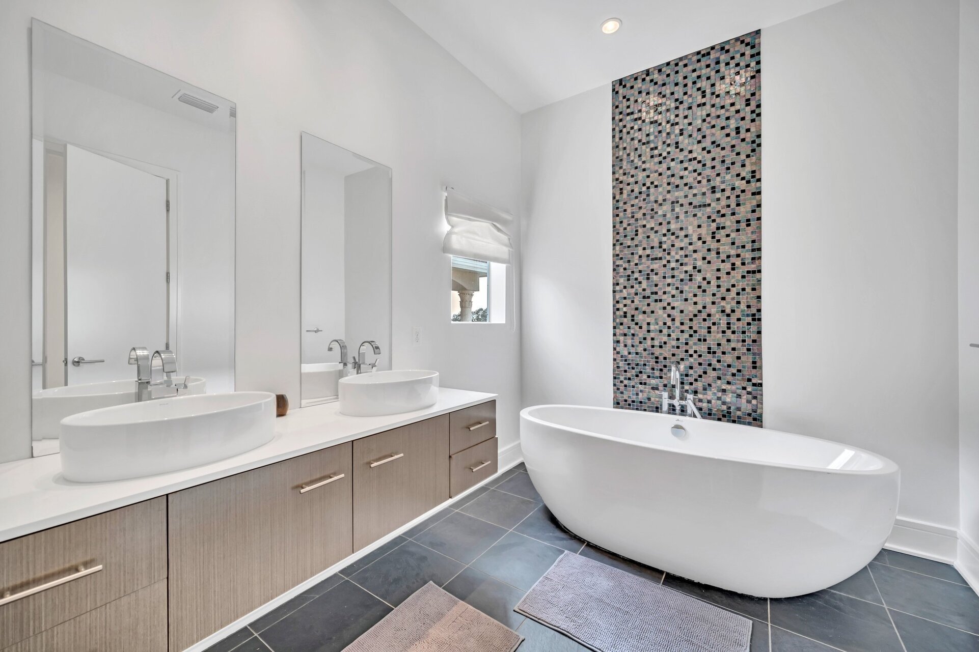 The large en suite bathroom features a soaking tub and walk in shower