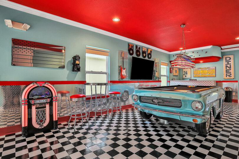Entertaining loft with 1967 Mustang slate pool table, Bluetooth jukebox, and 65-inch Smart TV