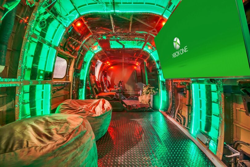 A game room with virtual reality games as well as simulators.