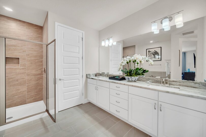 Enjoy the convenience of an en-suite bathroom featuring a walk-in shower for a refreshing start to your day