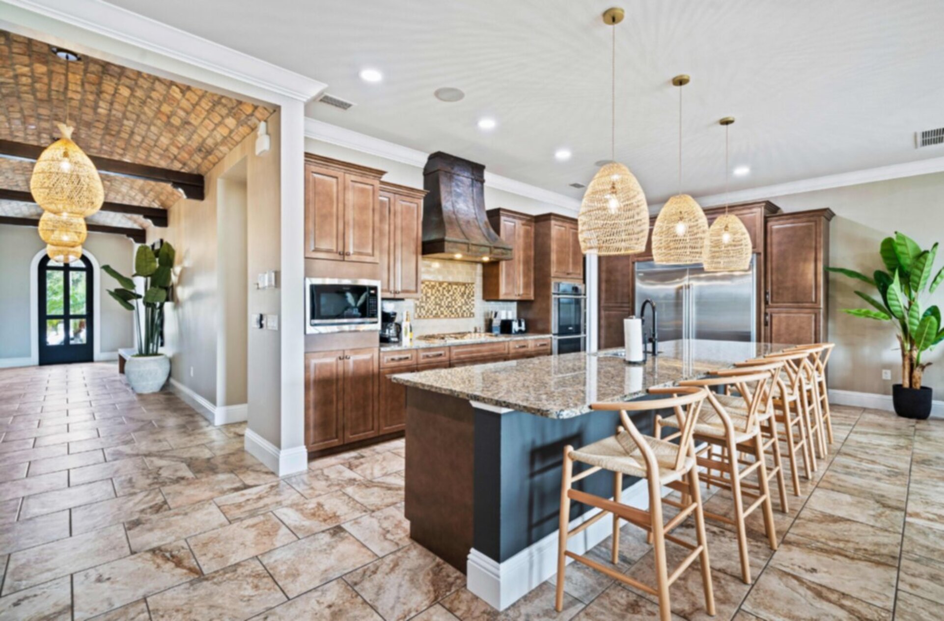 A fully equipped kitchen with breakfast bar