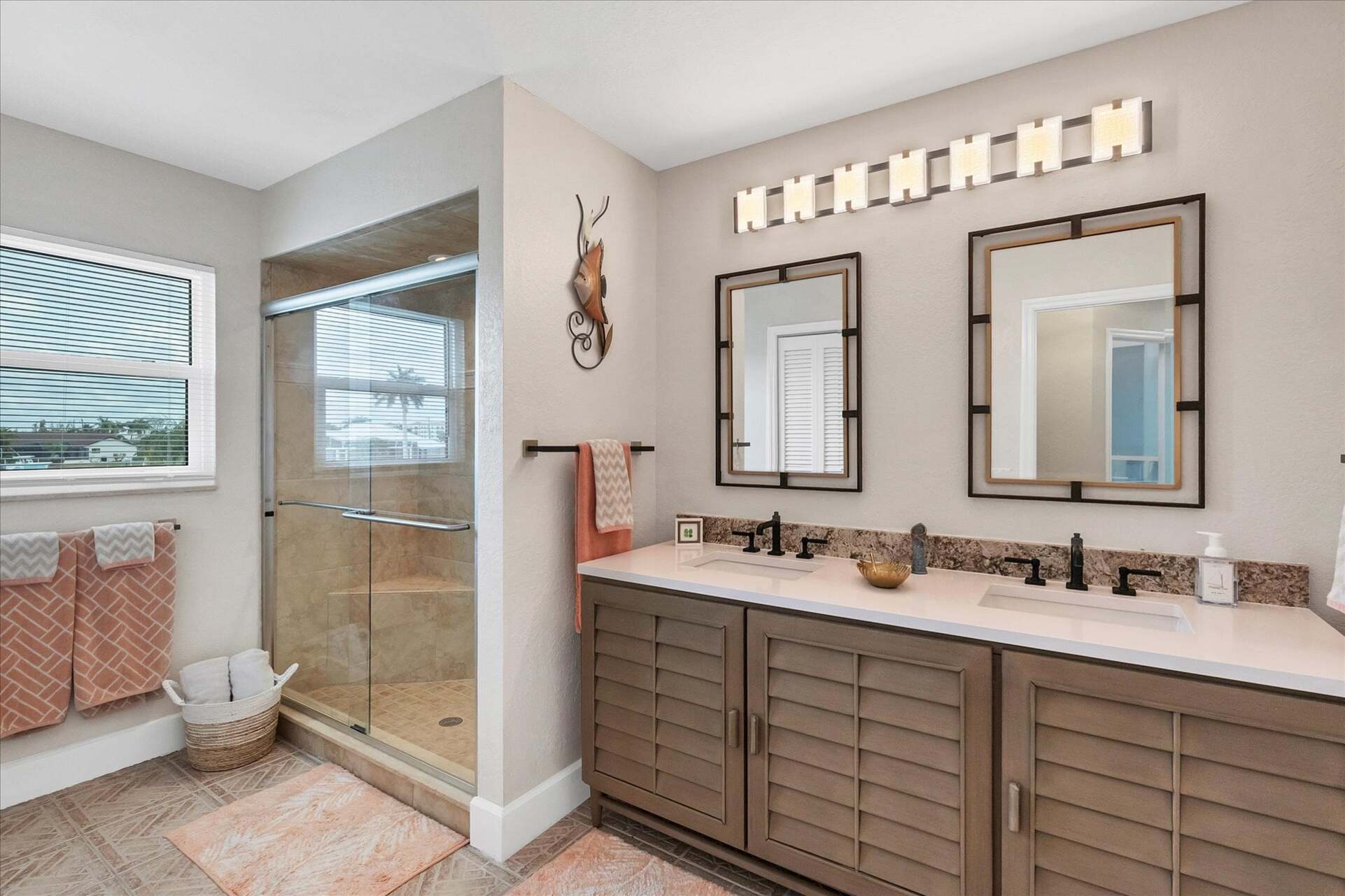 Downstairs guest bathroom with walk-in shower and double vanities