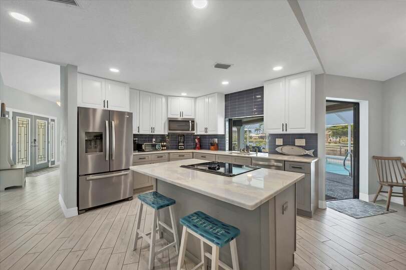 Beautiful, fully-equipped kitchen with new appliances. Kitchen island seats 2