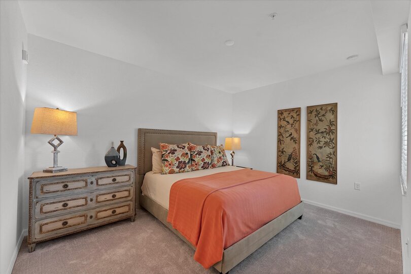 Primary bedroom with king bed and attached bathroom
