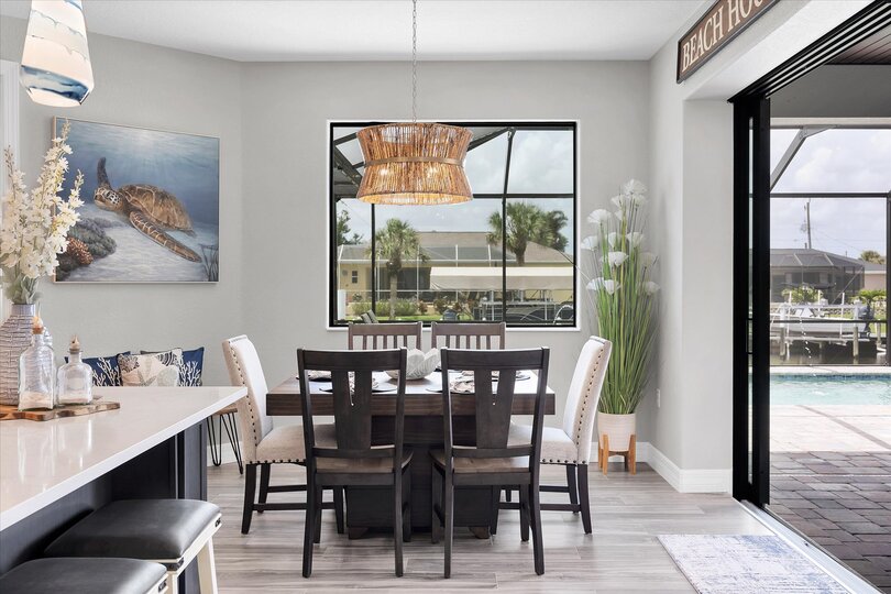 Dining seats 8 with additional seating for 4 at the kitchen island