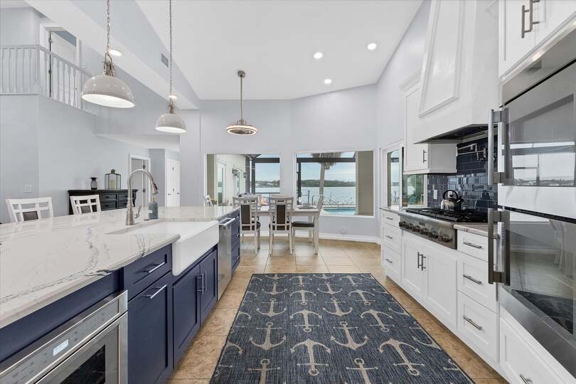 Gorgeous, fully-equipped kitchen features high-end stainless-steel appliances, and plenty of storage and counter top space
