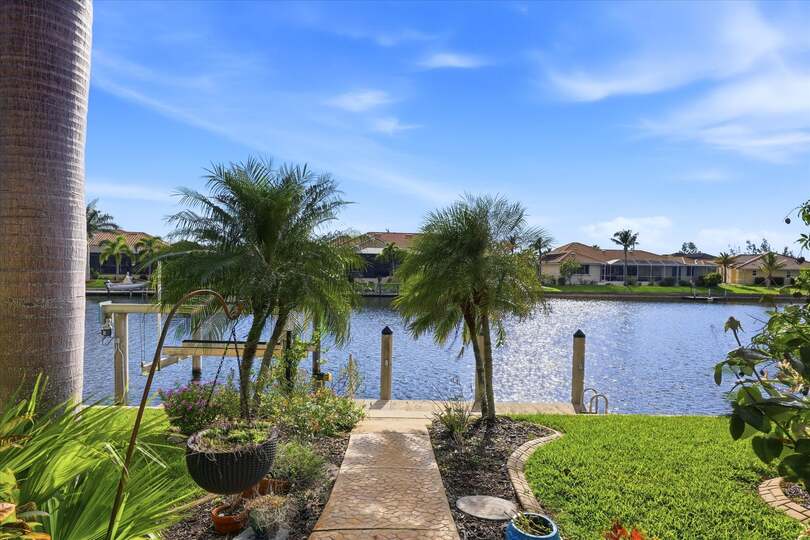 Path to canal and boat dock. Dock size: 7' x 30' with power & water