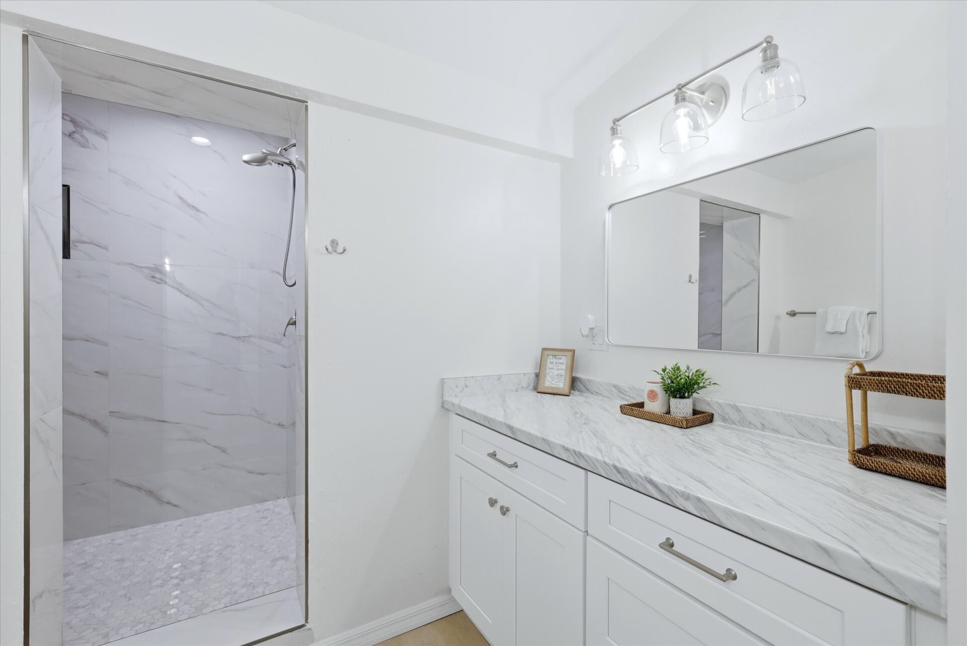 Primary bedroom's attached bathroom with large walk-in shower