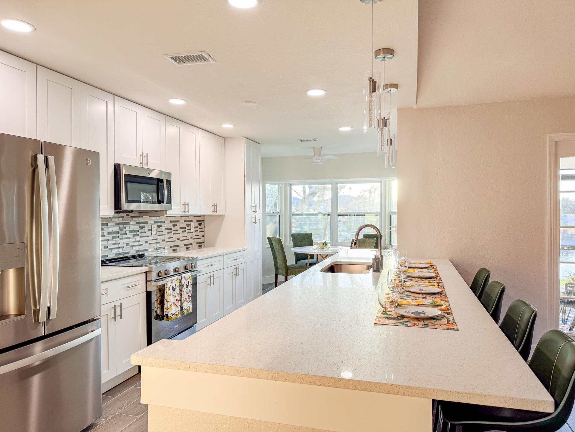 Bright, open, fully-equipped kitchen. Kitchen table seats 4 with the kitchen island seating an additional 4